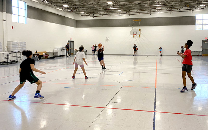 Lady Titans practicing basketball drills